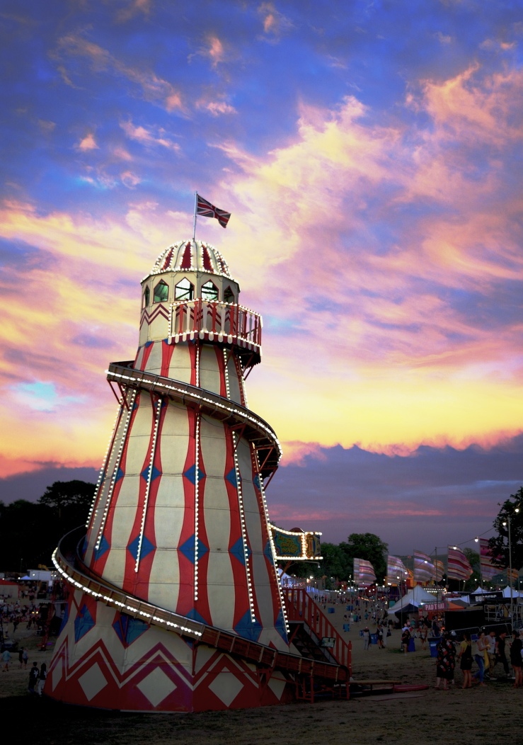 Sunset sky and helter skelter at Bestival 2018, Lulworth Estate, Dorset. Bestival circus 2018. Vintage funfair ride.